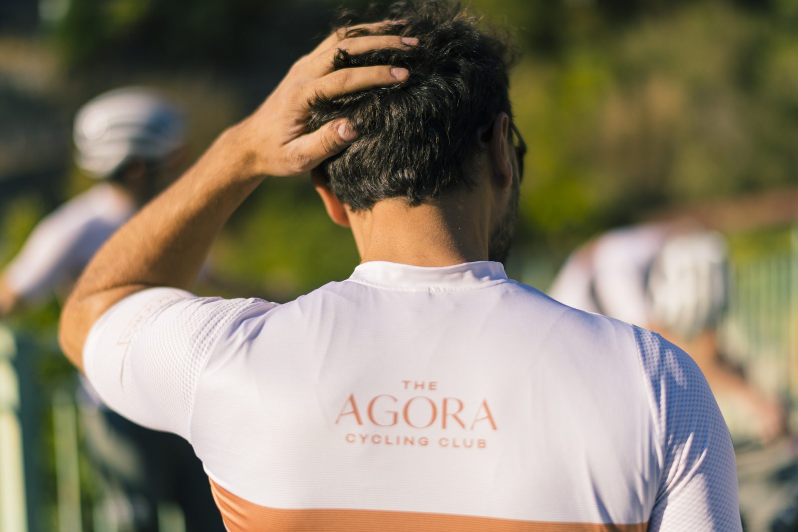 A rider in Agora Cycling Club kit pausing on a quiet road above Lefkara