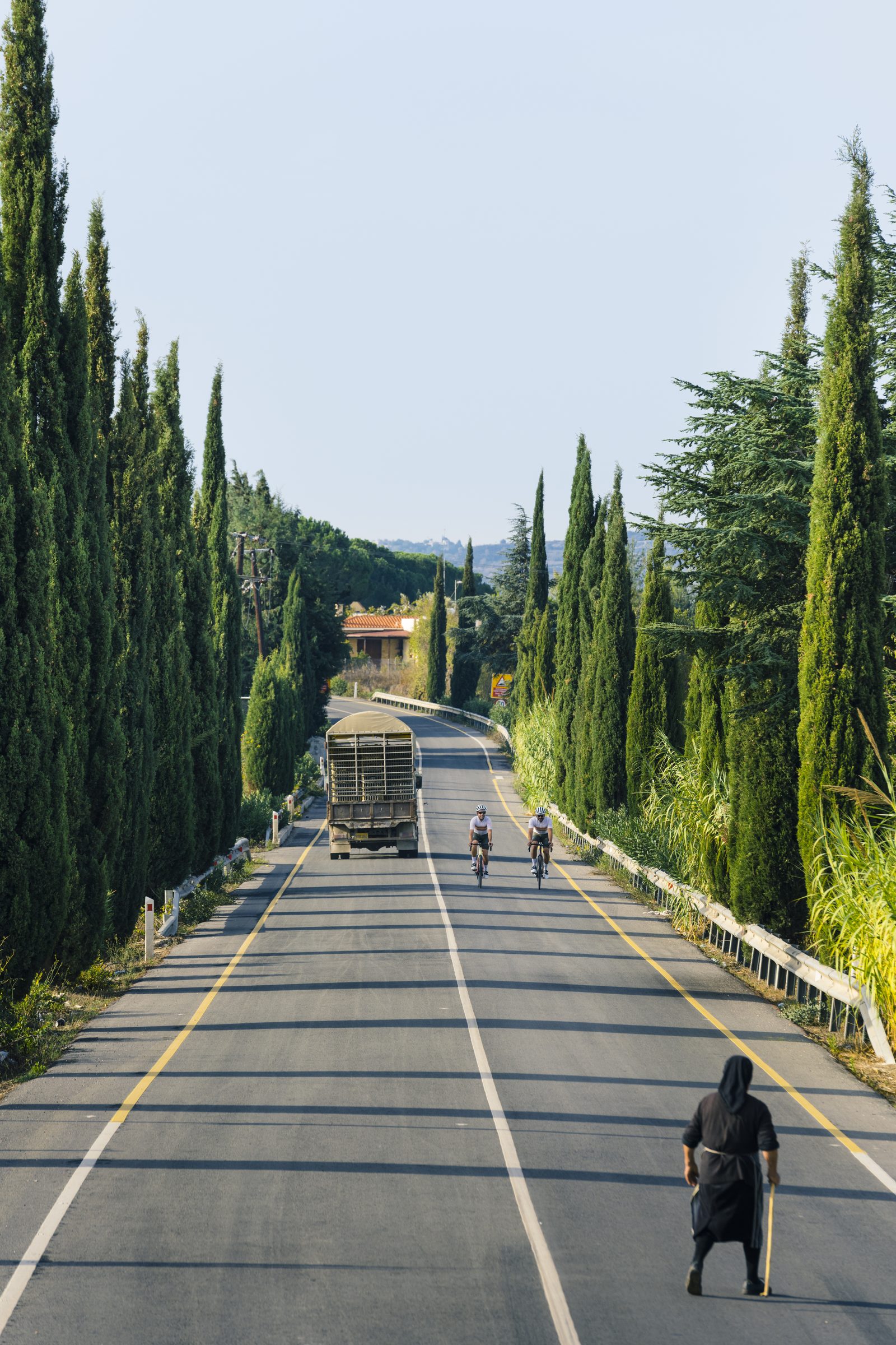A lone rider on the open road through the hills