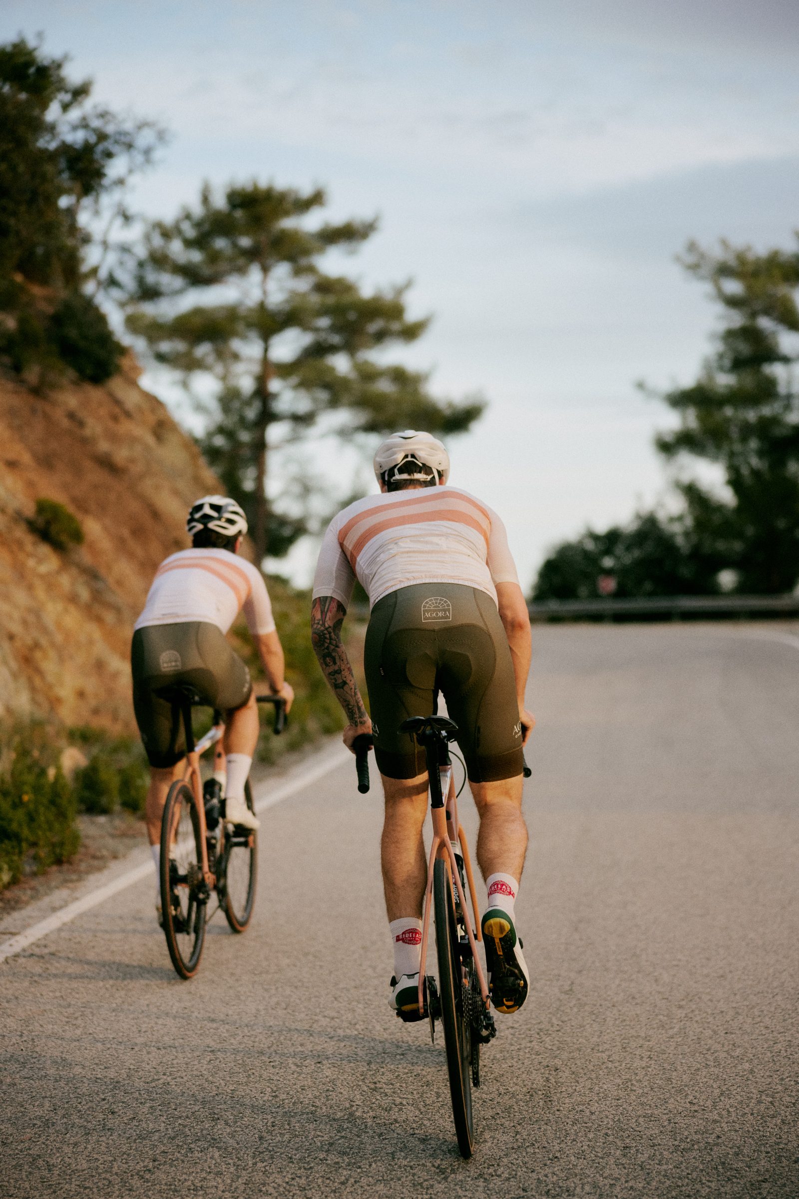 Cyclist on a fast straight through the hills